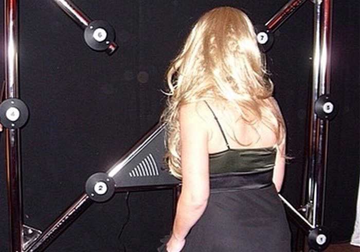 A lady playing a batak wall at a party
