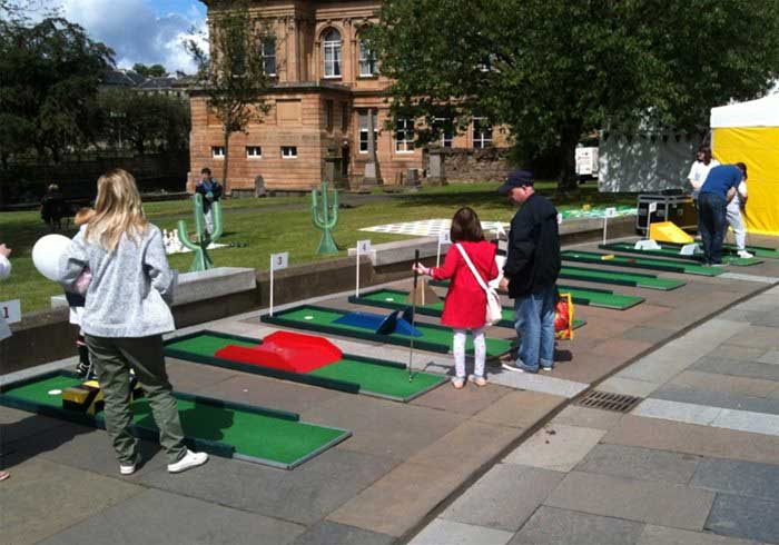 People playing Crazy Golf
