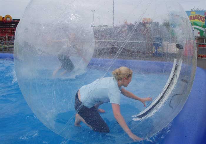 Lady in a zorb ball on water